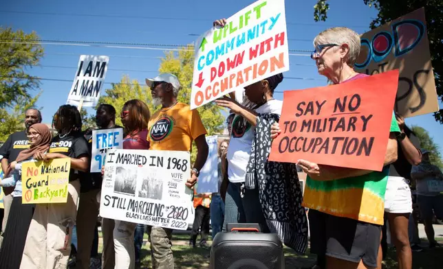 Protestors gather for a march in Memphis, Tenn., Saturday, Sept. 27, 2025, to protest against the deployment of National Guard troops to Memphis. (AP Photo/Nikki Boertman)