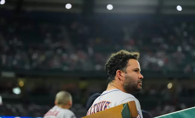 Houston Astros' Jose Altuve watches from the dugout during the second inning of a baseball game against the Los Angeles Angels Saturday, Sept. 27, 2025, in Anaheim, Calif. (AP Photo/Jae C. Hong)