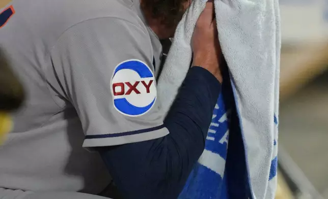 Houston Astros relief pitcher Bryan King sits in the dugout after he was pulled during the eighth inning of a baseball game against the Los Angeles Angels, Friday, Sept. 26, 2025, in Anaheim, Calif. (AP Photo/Jayne Kamin-Oncea)
