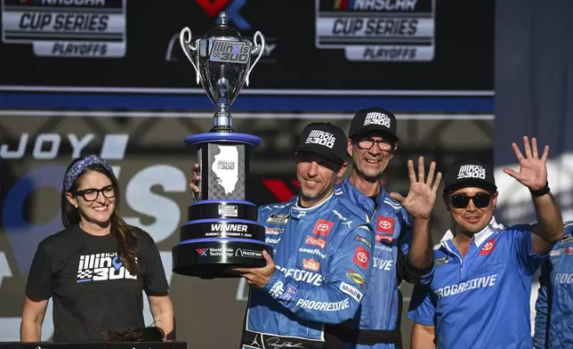 Denny Hamlin, second from left, celebrates after winning a NASCAR Cup Series auto race at World Wide Technology Raceway, Sunday, Sept. 7, 2025, in Madison, Ill. (AP Photo/Connor Hamilton)
