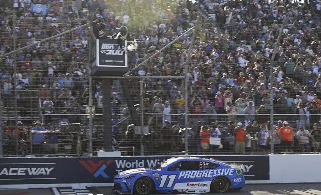 Denny Hamlin (11) wins a NASCAR Cup Series auto race at World Wide Technology Raceway, Sunday, Sept. 7, 2025, in Madison, Ill. (AP Photo/Connor Hamilton)