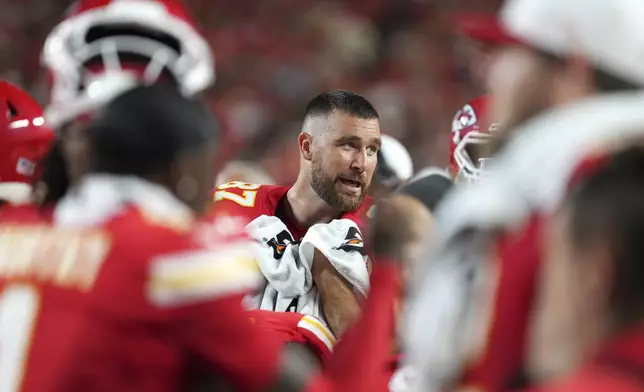 Kansas City Chiefs tight end Travis Kelce is seen in the bench area during the first half of a preseason NFL football game against the Chicago Bears Friday, Aug. 22, 2025, in Kansas City, Mo. (AP Photo/Ed Zurga)