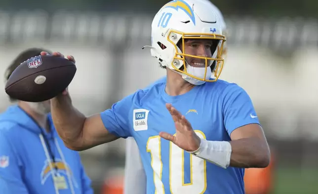 Los Angeles Chargers quarterback Justin Herbert throws the ball during a training session prior to an NFL football game against the Kansas City Chiefs in Sao Paulo, Wednesday, Sept. 3, 2025. (AP Photo/Fernando Llano)