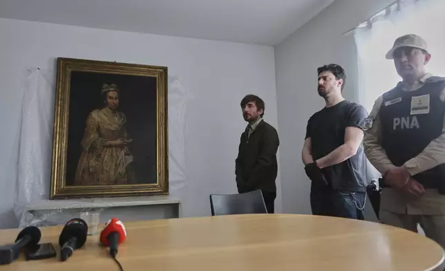 Giuseppe Ghislandi's 18th-century painting "Portrait of a Lady," reportedly stolen by a Nazi officer during World War II and discovered in the home of his daughter after appearing in a real estate listing, is displayed during a press conference by Prosecutor Daniel Adler in Mar del Plata, Argentina, Wednesday, Sept. 3, 2025. (AP Photo/Christian Heit)