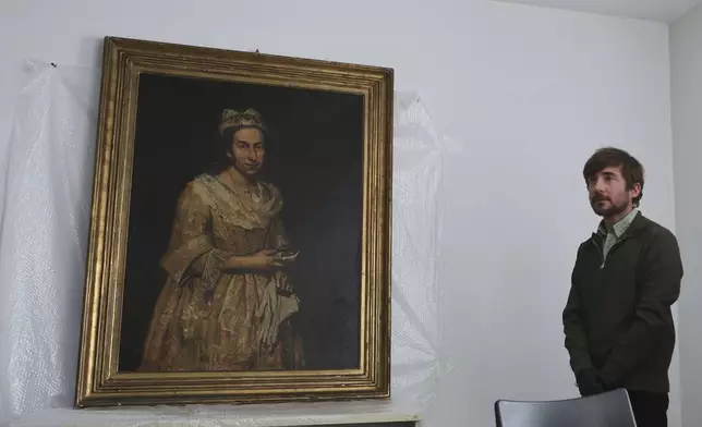 Giuseppe Ghislandi's 18th-century painting "Portrait of a Lady," reportedly stolen by a Nazi officer during World War II and discovered in the home of his daughter after appearing in a real estate listing, is displayed during a press conference by Prosecutor Daniel Adler in Mar del Plata, Argentina, Wednesday, Sept. 3, 2025. (AP Photo/Christian Heit)