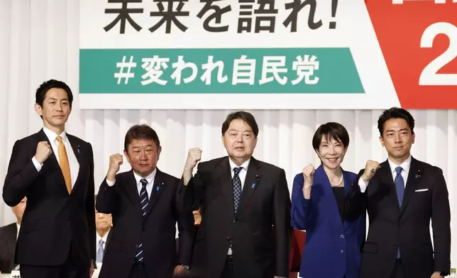 From left, Japan's former Economic Security Minister Takayuki Kobayashi, former Foreign Minister Toshimitsu Motegi, chief Cabinet Secretary Yoshimasa Hayashi, former Economic Security Minister Sanae Takaichi and Agriculture Minister Shinjiro Koizumi pose after they delivered speeches at the kick-off of the campaign for the Liberal Democratic Party's presidential election in Tokyo, Monday, Sept. 22, 2025. (Franck Robichon/Pool Photo via AP)