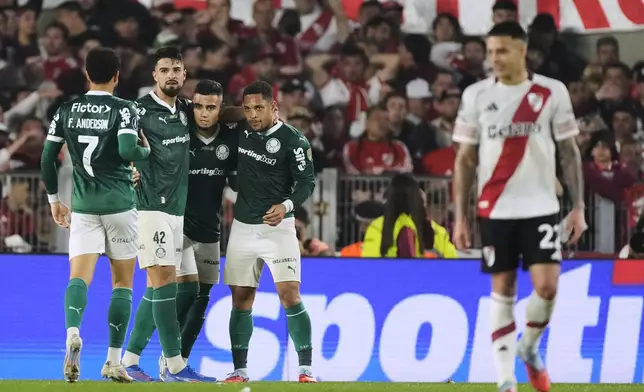 Vitor Roque of Brazil's Palmeiras, second from right, celebrates with teammates after scoring his side's second goal against Argentina's River Plate during a Copa Libertadores quarterfinal soccer match at the Monumental stadium in Buenos Aires, Argentina, Wednesday, Sept. 17, 2025. (AP Photo/Gustavo Garello)