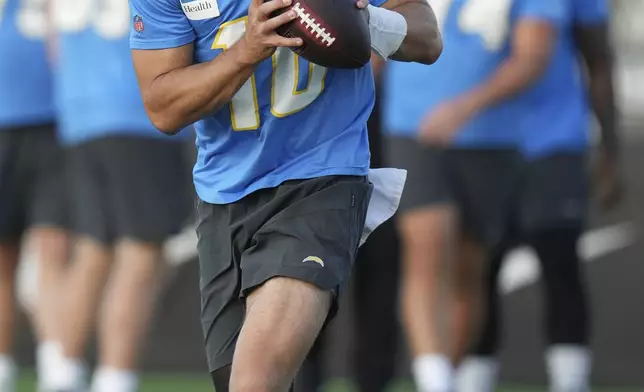 Los Angeles Chargers quarterback Justin Herbert looks to throw the ball during a training session prior to an NFL football game against the Kansas City Chiefs in Sao Paulo, Wednesday, Sept. 3, 2025. (AP Photo/Fernando Llano)