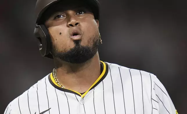 San Diego Padres' Luis Arraez exhales as he watches a ball go foul while batting during the fifth inning of a baseball game against the Baltimore Orioles Tuesday, Sept. 2, 2025, in San Diego. (AP Photo/Gregory Bull)