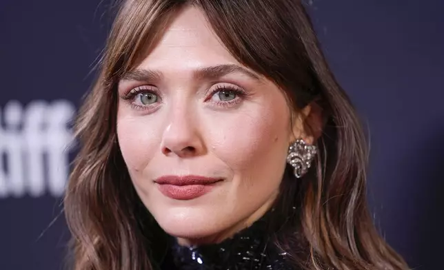 Elizabeth Olsen attends the premiere of "Eternity" during the Toronto International Film Festival on Sunday, Sept. 7, 2025, at Roy Thomson Hall in Toronto. (AP Photo/Chris Pizzello)