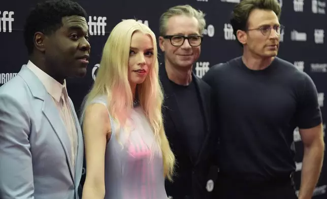 Sam Richardson, from left, Anya Taylor-Joy, producer Robert Walak, and Chris Evans attend the premiere of "Sacrifice" at the Princess of Wales Theatre during the Toronto International Film Festival on Saturday, Sept. 6, 2025, in Toronto. (AP Photo/Chris Pizzello)