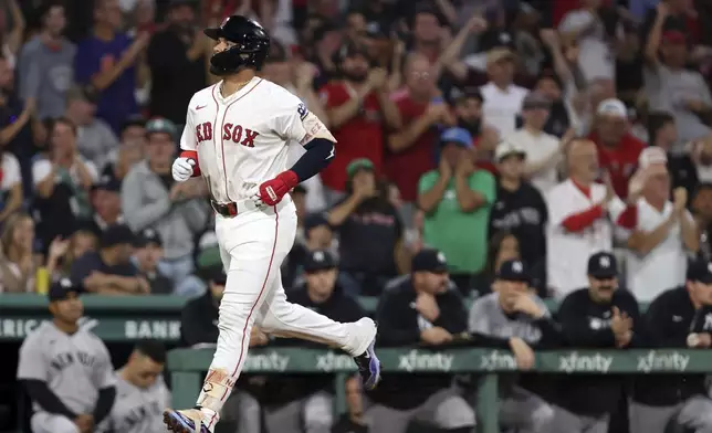 Boston Red Sox's Carlos Narvaez heads for home plate following his solo home run in the bottom of the first inning of a baseball game against the New York Yankees, Sunday, Sept. 14, 2025, in Boston. (AP Photo/Jim Davis)