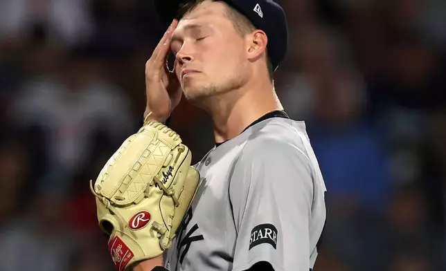 New York Yankees starting pitcher Will Warren reacts on the mound during the bottom of the first inning of a baseball game against the Boston Red Sox, Sunday, Sept. 14, 2025, in Boston. (AP Photo/Jim Davis)