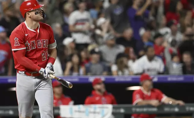 Los Angeles Angels designated hitter Mike Trout watches his hit clear the wall for a home run in the eighth inning against the Colorado Rockies on Saturday, Sept. 20, 2025, in Denver. (AP Photo/RJ Sangosti)