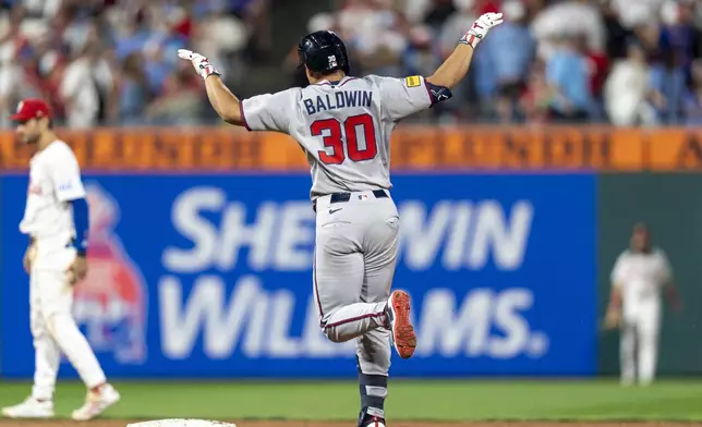 Atlanta Braves' Drake Baldwin reacts after his two-run home run during the ninth inning of a baseball game against the Philadelphia Phillies, Sunday, Aug. 31, 2025, in Philadelphia. (AP Photo/Chris Szagola)