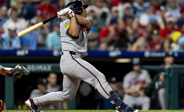 Atlanta Braves' Drake Baldwin hits a two-run home run during the ninth inning of a baseball game against the Philadelphia Phillies, Sunday, Aug. 31, 2025, in Philadelphia. (AP Photo/Chris Szagola)