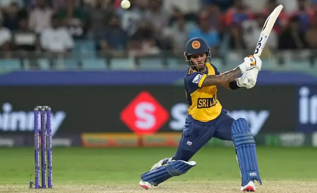 Sri Lanka's Pathum Nissanka plays a shot during the Asia Cup cricket match between India and Sri Lanka at Dubai International Cricket Stadium, United Arab Emirates, Friday, Sept. 26, 2025. (AP Photo/Altaf Qadri)