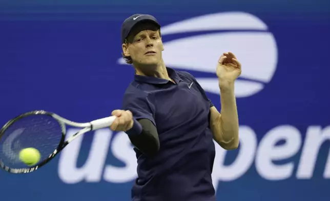 Jannik Sinner, of Italy, returns a shot to Lorenzo Musetti, of Italy, during the quarterfinal round of the U.S. Open tennis championships, Wednesday, Sept. 3, 2025, in New York. (AP Photo/Adam Hunger)