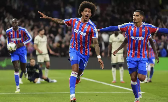 Crystal Palace's Chris Richards, center, celebrates scoring their side's first goal of the game against Milwall during an English League Cup third round soccer match, Tuesday Sept. 16, 2025, at Selhurst Park in London. (Adam Davy/PA via AP)