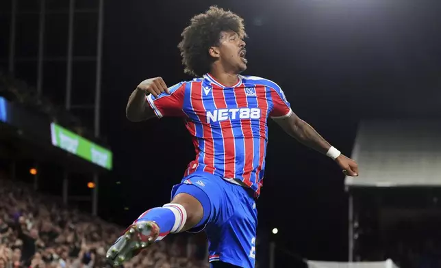 Crystal Palace's Chris Richards celebrates scoring their side's first goal of the game against Milwall during an English League Cup third round soccer match, Tuesday Sept. 16, 2025, at Selhurst Park in London. (Adam Davy/PA via AP)