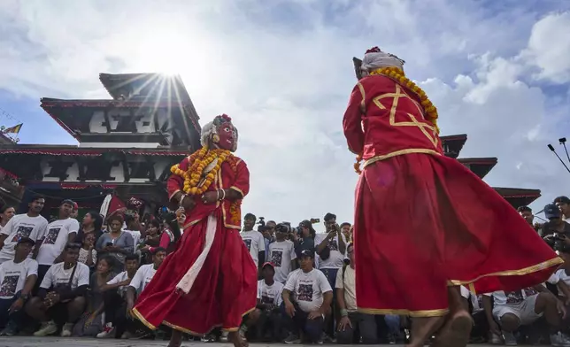 Masked dancers perform during Indra Jatra, a festival that marks the end of the rainy season in Kathmandu, Nepal, Saturday, Sept. 6, 2025. (AP Photo/Niranjan Shrestha)
