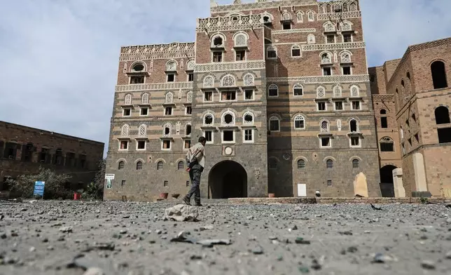 A man inspects the damage outside the National Museum, following the Israeli airstrikes on Wednesday in Sanaa, Yemen, Thursday, Sept. 11, 2025. (AP Photo/Osamah Abdulrahman)