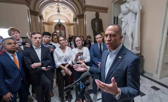 House Minority Leader Hakeem Jeffries, D-N.Y., speaks with reporters before he and the top congressional leaders go to the White House to meet with President Donald Trump on the looming government funding crisis, at the Capitol in Washington, Monday, Sept. 29, 2025. (AP Photo/J. Scott Applewhite)