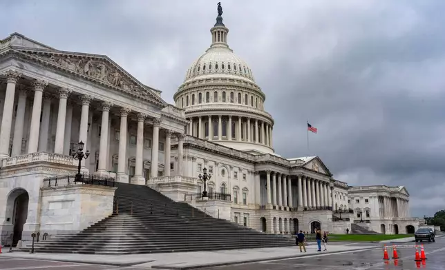The Capitol is seen during rainy weather just days before federal money runs out which could trigger a government shutdown, in Washington, Thursday, Sept. 25, 2025. (AP Photo/J. Scott Applewhite)