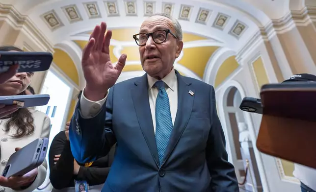 Senate Minority Leader Chuck Schumer, D-N.Y., talks to reporters as he departs for a meeting with President Donald Trump and the top four congressional leaders to discuss the looming government funding crisis, at the Capitol in Washington, Monday, Sept. 29, 2025. (AP Photo/J. Scott Applewhite)