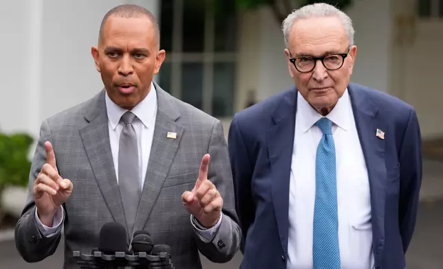 House Minority Leader Hakeem Jeffries, D-N.Y., and Senate Minority Leader Chuck Schumer of N.Y., talk to reporters outside the West Wing of the White House, Monday, Sept. 29, 2025, in Washington. (AP Photo/Alex Brandon)