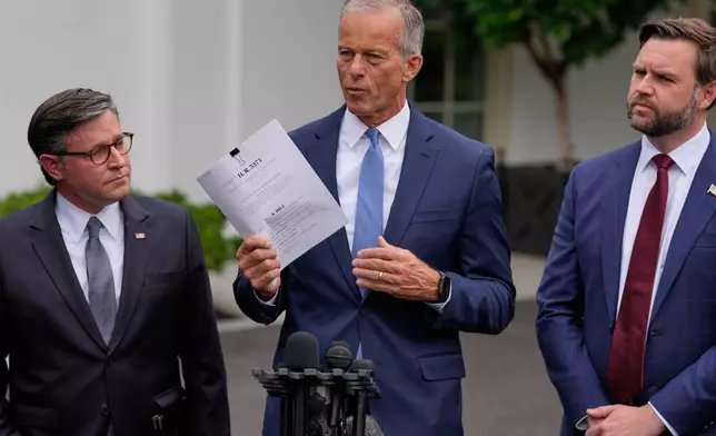 Senate Majority Leader John Thune, R-S.D., talks to reporters outside the West Wing of the White House, Monday, Sept. 29, 2025, in Washington, as House Speaker Mike Johnson of La., and Vice President JD Vance, listen. (AP Photo/Alex Brandon)