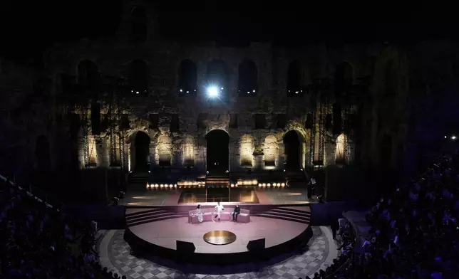 Greece's Prime Minister Kyriakos Mitsotakis, center, and Demis Hassabis, CEO of Google's artificial intelligence research company DeepMind, right, discuss the future of AI, ethics and democracy as the moderator Linda Rottenberg, Co-founder &amp; CEO of Endeavor looks on during an event at the Odeon of Herodes Atticus in Athens, Greece, Friday, Sept. 12, 2025. (AP Photo/Thanassis Stavrakis)
