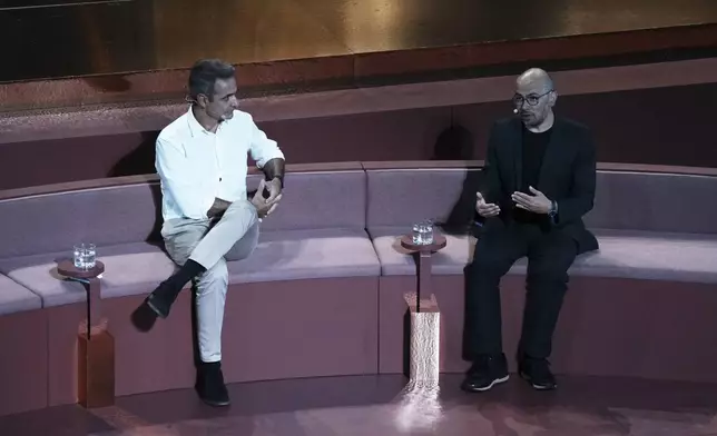 Demis Hassabis, CEO of Google's artificial intelligence research company DeepMind, right, and Greece's Prime Minister Kyriakos Mitsotakis discuss the future of AI, ethics and democracy during an event at the Odeon of Herodes Atticus, in Athens, Greece, Friday, Sept. 12, 2025. (AP Photo/Thanassis Stavrakis)