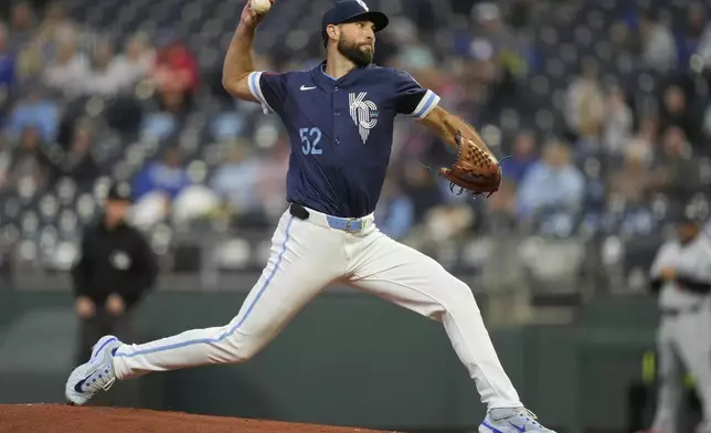 Kansas City Royals starting pitcher Michael Wacha throws during the first inning of a baseball game against the Minnesota Twins, Friday, Sept. 5, 2025, in Kansas City, Mo. (AP Photo/Charlie Riedel)