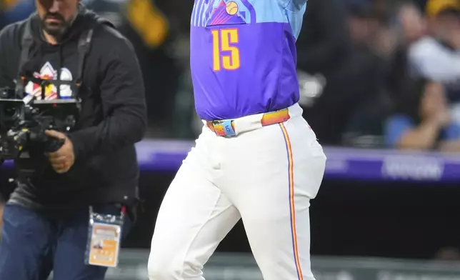 Colorado Rockies' Hunter Goodman (15) celebrates after his solo home run against the San Diego Padres during the third inning of a baseball game Friday, Sept. 5, 2025, in Denver. (AP Photo/Jack Dempsey)