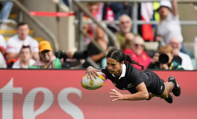 New Zealand's Braxton Sorensen-McGee scores a try during the Women's Rugby World Cup bronze match between New Zealand and France at the Allianz Stadium, Twickenham, London, Saturday, Sept. 27, 2025. (AP Photo/Alastair Grant)