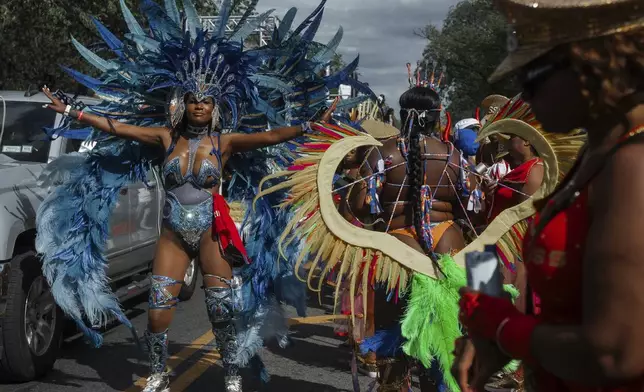 Costumed dancers perform during the West Indian Day Parade on Monday, Sept. 1, 2025, in the Brooklyn borough of New York. (AP Photo/Olga Fedorova)