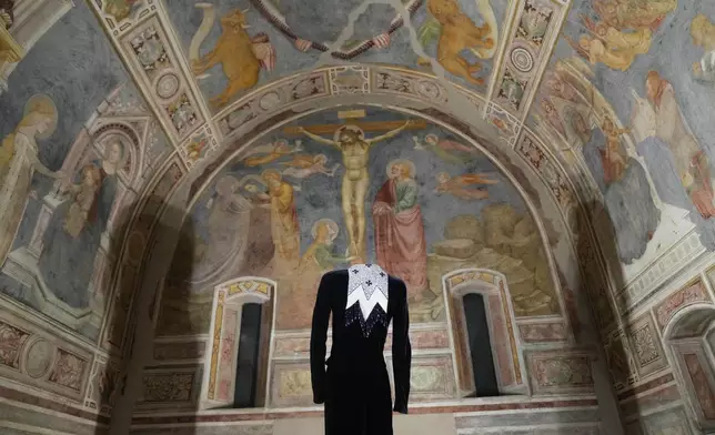 Giorgio Armani's creations are displayed during the exhibition "Giorgio Armani - 50 Years" opened to the public at the Pinacoteca di Brera in Milan, Italy, Wednesday, Sept. 24 2025. (AP Photo/Antonio Calanni)