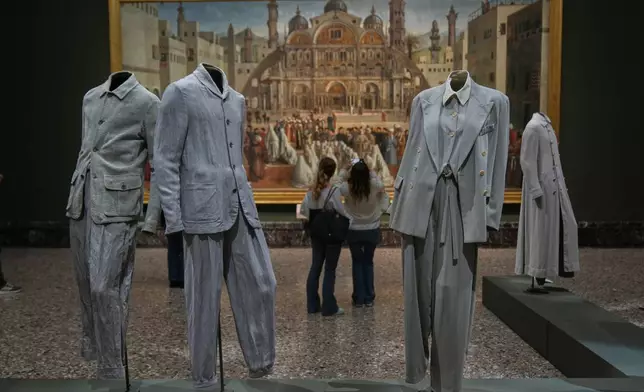 Giorgio Armani's creations are displayed during the exhibition "Giorgio Armani - 50 Years" opened to the public at the Pinacoteca di Brera in Milan, Italy, Wednesday, Sept. 24 2025. (AP Photo/Antonio Calanni)