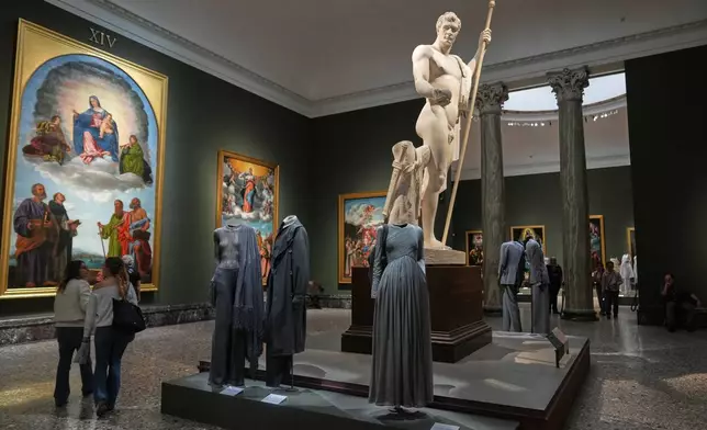 Giorgio Armani's creations are displayed during the exhibition "Giorgio Armani - 50 Years" opened to the public at the Pinacoteca di Brera in Milan, Italy, Wednesday, Sept. 24 2025. (AP Photo/Antonio Calanni)