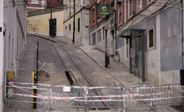 View of the site where a tourist streetcar derailed and crashed in Lisbon, Portugal, Friday, Sept. 5, 2025. (AP Photo/Armando Franca)