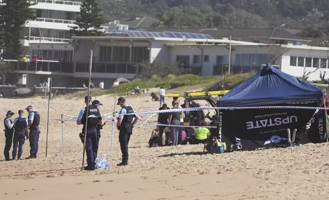 Police work at the site of a fatal shark attack at Dee Why Beach in Sydney, Australia, Saturday, Sept. 6, 2025. (AP Photo/Mark Baker)