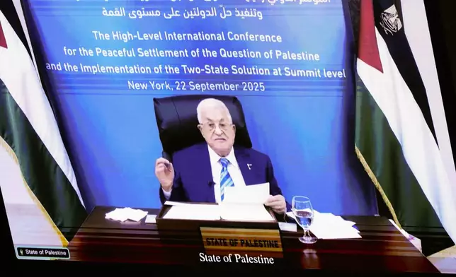 Palestinian President Mahmoud Abbas appears on a screen as he speaks virtually during a high-profile meeting at the United Nations aimed at galvanizing support for a two-state solution to the Israeli-Palestinian conflict Monday, Sept. 22, 2025, at UN headquarters (AP Photo/Yuki Iwamura)