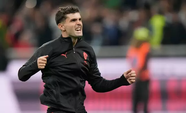 AC Milan's Christian Pulisic celebrates after the Serie A soccer match between AC Milan and Napoli at the San Siro stadium in Milan, Italy, Sunday, Sept. 28, 2025. (AP Photo/Luca Bruno)