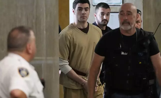 Luigi Mangione is escorted into Manhattan state court in New York, Tuesday, Sept. 16, 2025. (AP Photo/Seth Wenig)