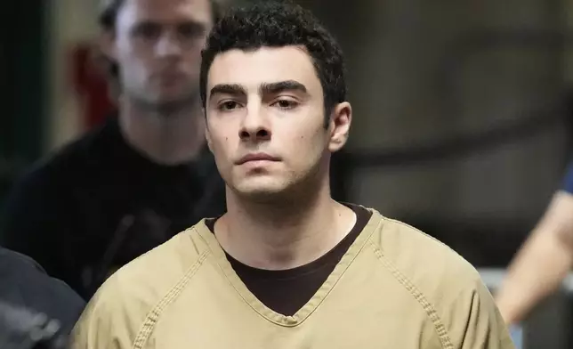 Luigi Mangione is escorted into Manhattan state court in New York, Tuesday, Sept. 16, 2025. (AP Photo/Seth Wenig)