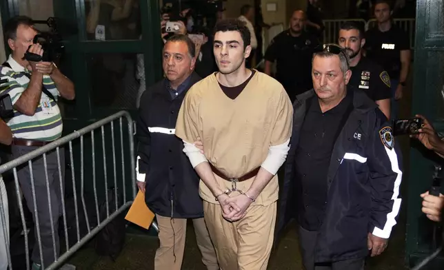 Luigi Mangione is escorted into Manhattan state court in New York, Tuesday, Sept. 16, 2025. (AP Photo/Seth Wenig)
