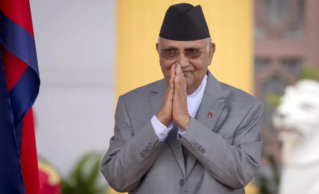 FILE -The then newly elected Prime Minister Khadga Prasad Oli greets after the oath of office in President residence in Kathmandu, Nepal, July 15, 2024. (AP Photo/Niranjan Shrestha, File)