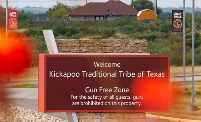 A sign welcoming visitors to Kickapoo Lucky Eagle Casino and declaring the area a "gun-free zone" in Eagle Pass, Texas, shown, Monday, Sept. 29, 2025. (Sam Owens/The San Antonio Express-News via AP)