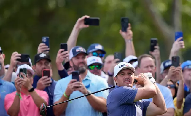 United States' Bryson DeChambeau watches his tee shot on the 12th hole during a practice round for the Ryder Cup golf tournament, Tuesday, Sept. 23, 2025, in Farmingdale, N.Y., at Bethpage State Park's Black Course. (AP Photo/Robert Bukaty)